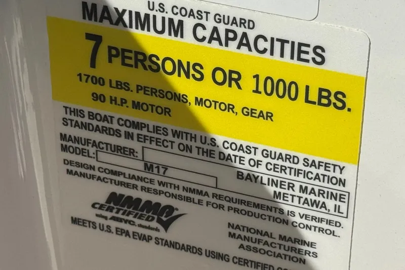 Slide: The Image of 2023 Bayliner Element M17 capacity label, 7 persons or 1000 lbs, 90 HP motor. - 28