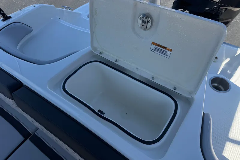 Slide: The Image of Open storage compartment on 2023 Bayliner Element M17 boat. - 19