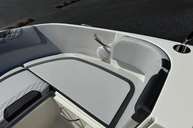 Slide: The Image of 2023 Bayliner Element M17 boat interior with cushioned seating and speaker. - 14