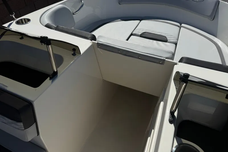 Slide: The Image of 2023 Bayliner Element M17 boat interior with seating and storage compartments. - 16