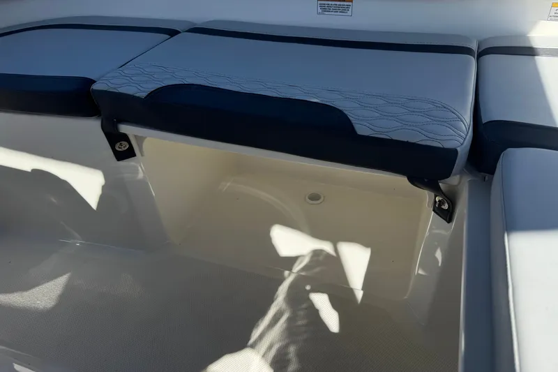 Slide: The Image of 2023 Bayliner Element M17 boat seat storage compartment with cushioned seating. - 18