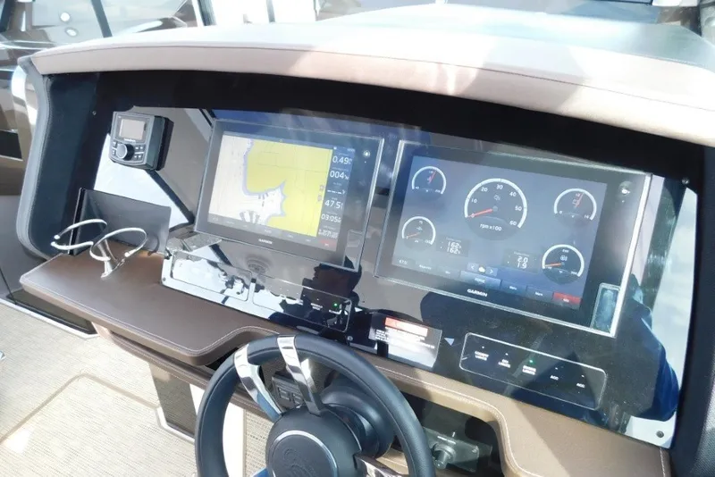 Slide: The Image of Dashboard of a 2019 Cobalt A36BR boat with navigation and control displays. - 18
