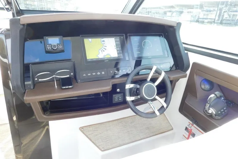 Slide: The Image of Helm of 2019 Cobalt A36BR boat with modern navigation and control systems. - 16