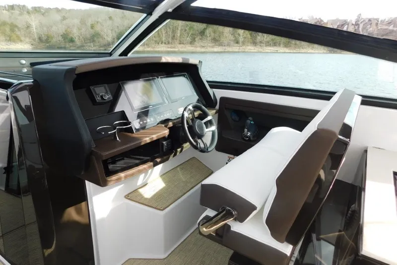 Slide: The Image of 2019 Cobalt A36BR boat interior with modern dashboard and steering wheel. - 15