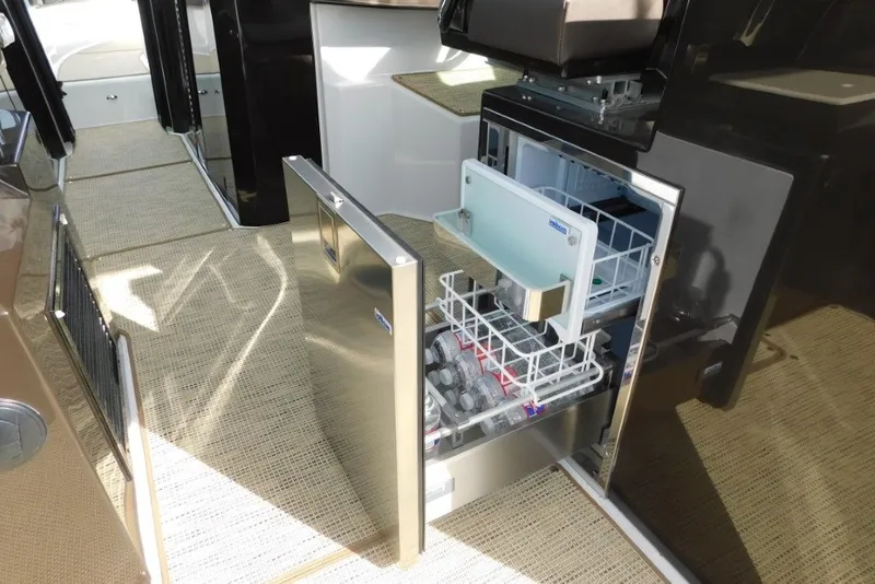 Slide: The Image of Open drawer refrigerator on 2019 Cobalt A36BR boat, showcasing interior storage and design. - 14