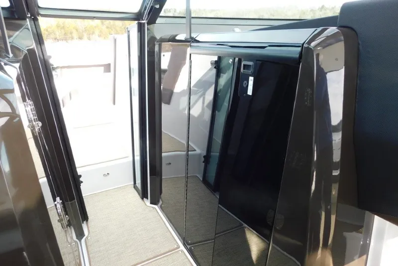 Slide: The Image of Interior view of 2019 Cobalt A36BR boat, featuring sleek glass doors and modern design. - 22