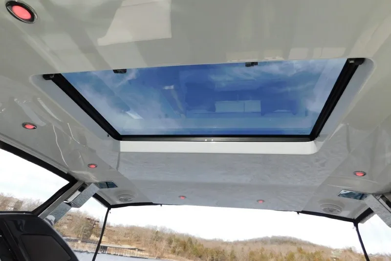 Slide: The Image of 2019 Cobalt A36BR boat interior with panoramic sunroof and LED lighting. - 31