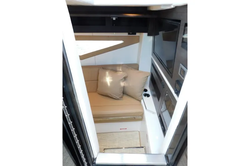Slide: The Image of Interior of 2019 Cobalt A36BR boat with beige seating and modern amenities. - 23