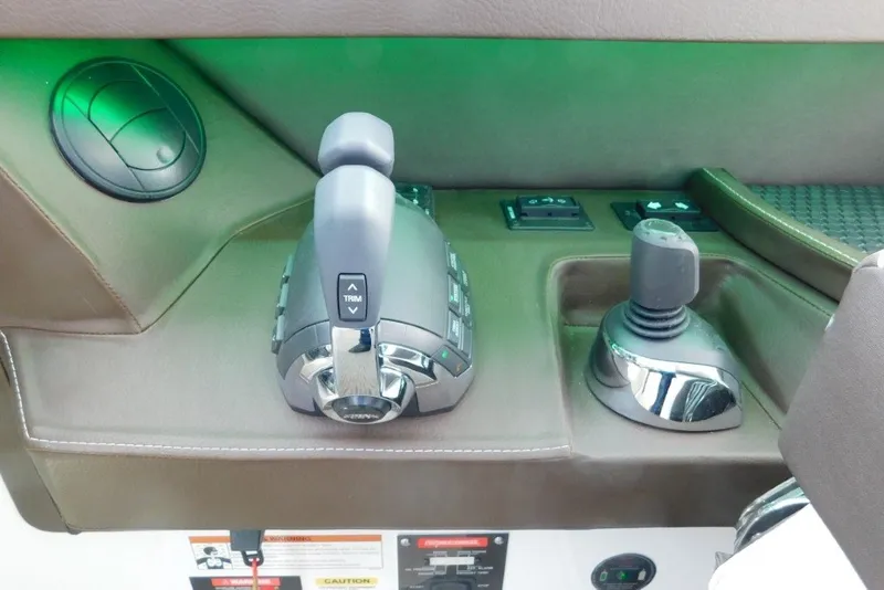 Slide: The Image of Control panel of a 2019 Cobalt A36BR boat with throttle and joystick. - 19