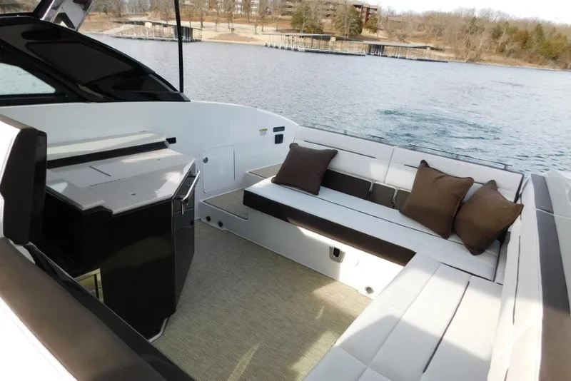 Slide: The Image of Luxurious 2019 Cobalt A36BR boat interior with comfortable seating and scenic lake view. - 32