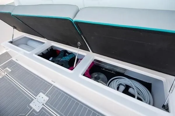 Slide: The Image of Storage compartments on a 2021 Regal 38 SAV boat, featuring organized boating gear. - 16
