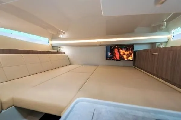 Slide: The Image of Luxurious interior cabin of 2021 Regal 38 SAV yacht with modern amenities and cozy seating. - 26
