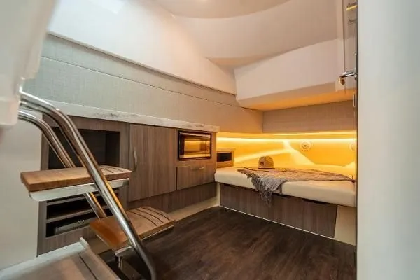 Slide: The Image of Luxurious interior cabin of 2021 Regal 38 SAV yacht with modern amenities and cozy lighting. - 25