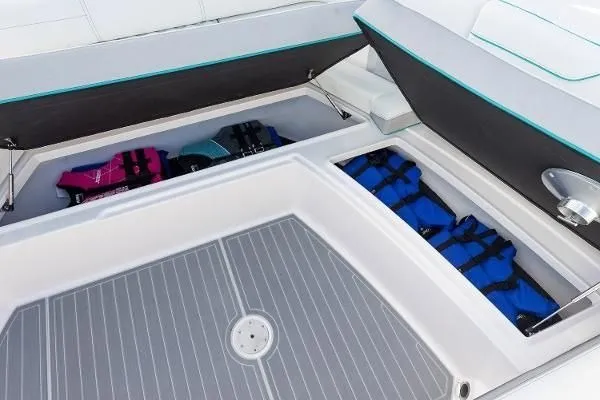 Slide: The Image of Storage compartment on 2021 Regal 38 SAV boat with life jackets neatly organized. - 22