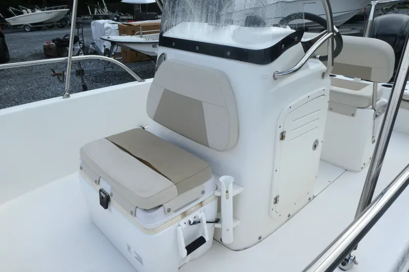 Slide: The Image of 2017 Boston Whaler 170 Dauntless boat interior with seating and console. - 11
