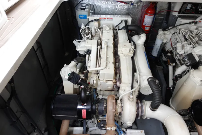 Slide: The Image of Engine compartment of a 2001 Sea Ray 410 Express Cruiser, showcasing detailed machinery. - 27