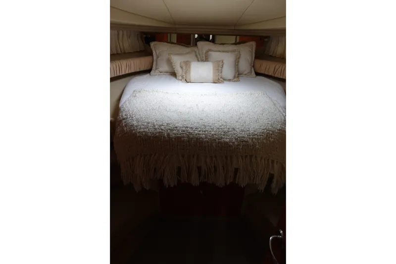 Slide: The Image of Luxurious cabin interior of 2001 Sea Ray 410 Express Cruiser with cozy bedding. - 20