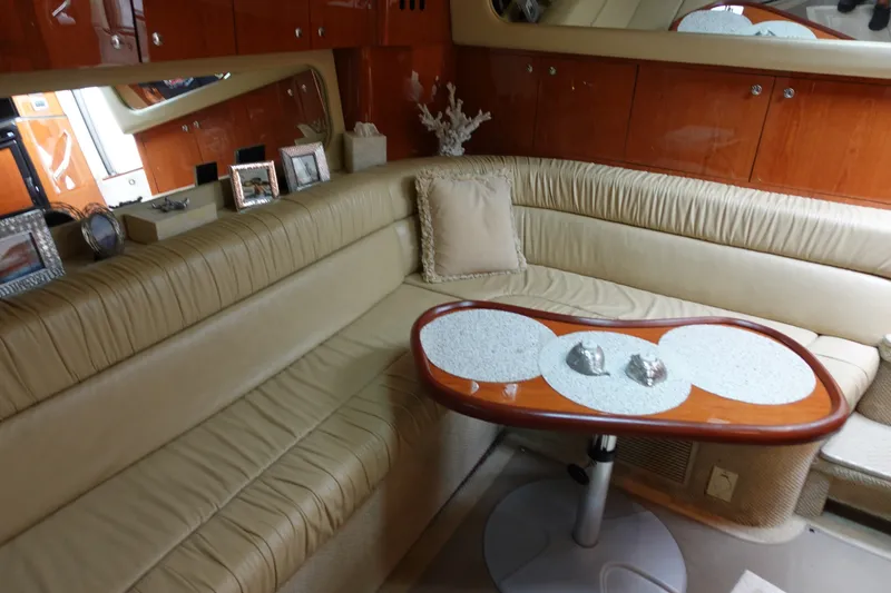 Slide: The Image of Luxurious interior of 2001 Sea Ray 410 Express Cruiser with leather seating and elegant decor. - 14