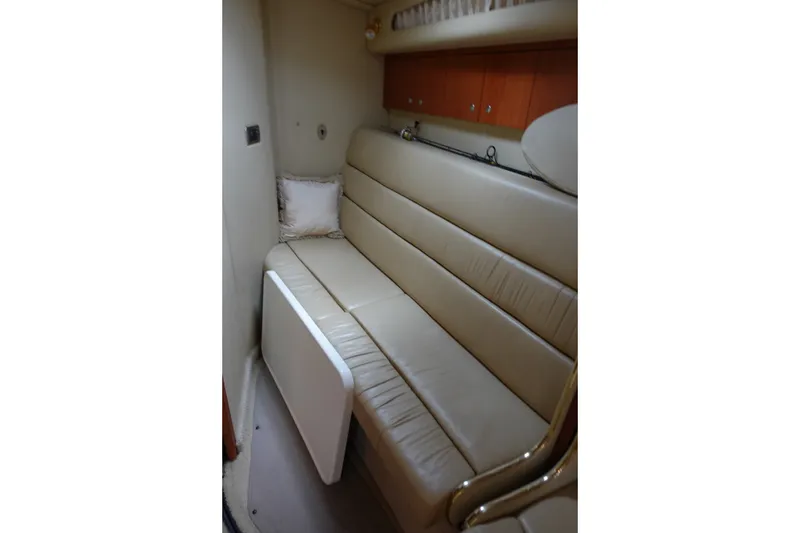 Slide: The Image of Interior of 2001 Sea Ray 410 Express Cruiser with beige leather seating. - 22