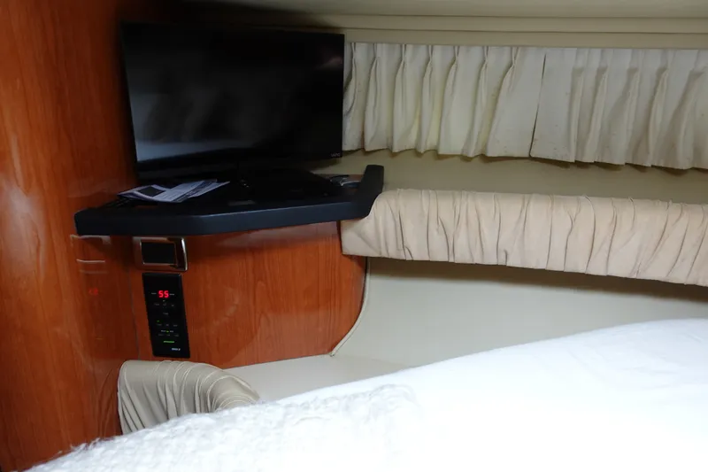 Slide: The Image of Interior of 2001 Sea Ray 410 Express Cruiser with TV and wood paneling. - 21