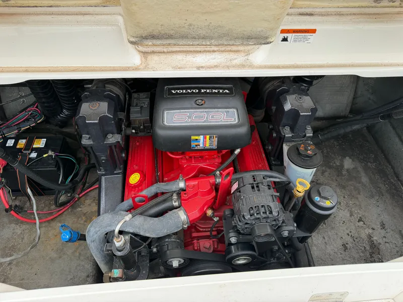 Slide: The Image of The engine compartment of a 2008 Glastron GX 205 features a Volvo Penta 5.0 GL engine. - 18