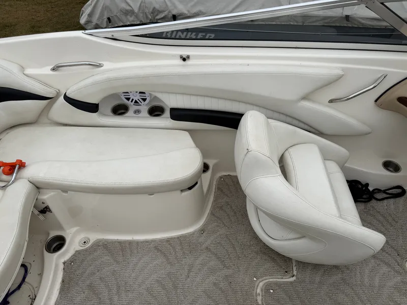 Slide: The Image of Interior of a 2008 Glastron GX 205 with white seating and speakers. - 15