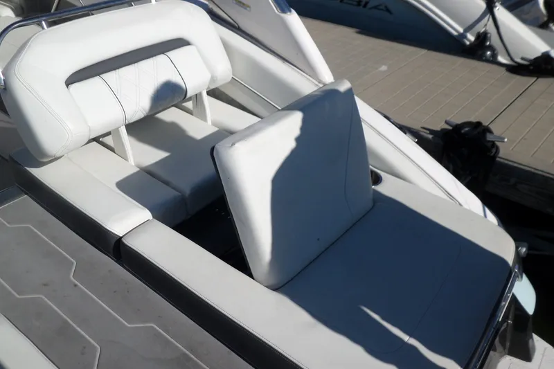 Slide: The Image of 2020 Regal LS6 boat with white leather seating and adjustable backrest. - 35