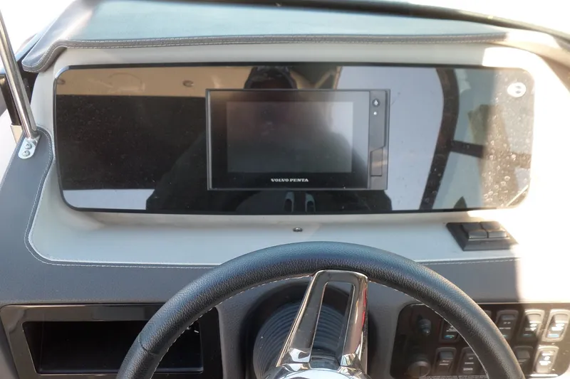 Slide: The Image of 2020 Regal LS6 dashboard with Volvo Penta display and steering wheel. - 26