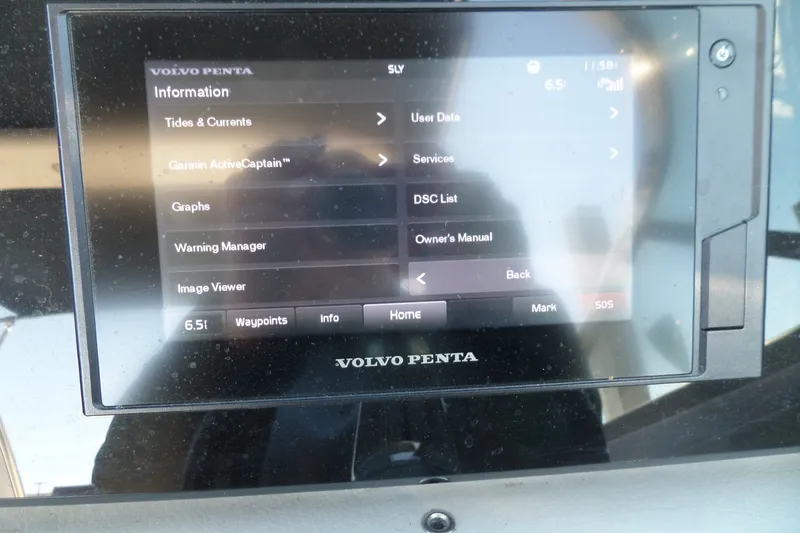 Slide: The Image of Volvo Penta display screen showing navigation and system information on a Regal LS6 2020 boat. - 44