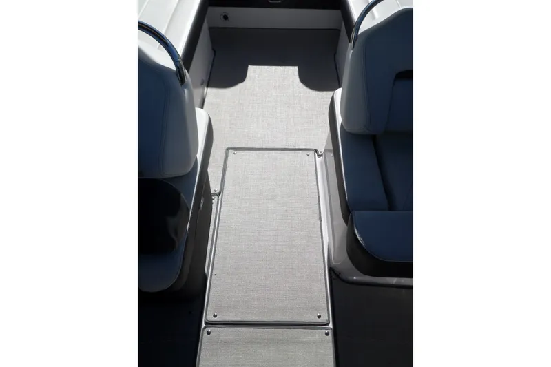 Slide: The Image of Interior view of 2020 Regal LS6 boat, featuring sleek seating and flooring design. - 23