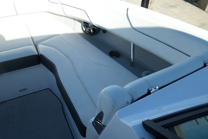 Slide: The Image of 2020 Regal LS6 boat interior with sleek white seating and cup holder. - 15