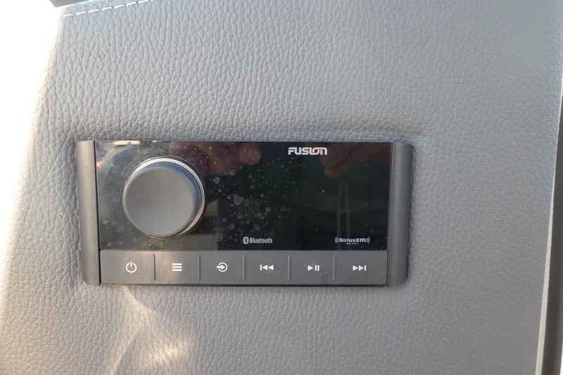 Slide: The Image of Fusion audio control panel in 2020 Regal LS6 boat, featuring Bluetooth and SiriusXM capabilities. - 19
