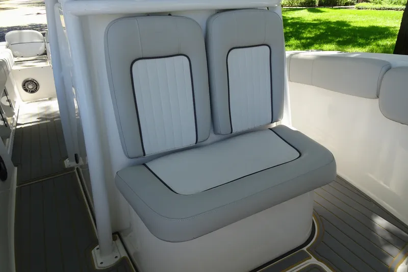 Slide: The Image of 2021 Sea Fox 248 Commander boat seating with cushioned backrest and deck flooring. - 17