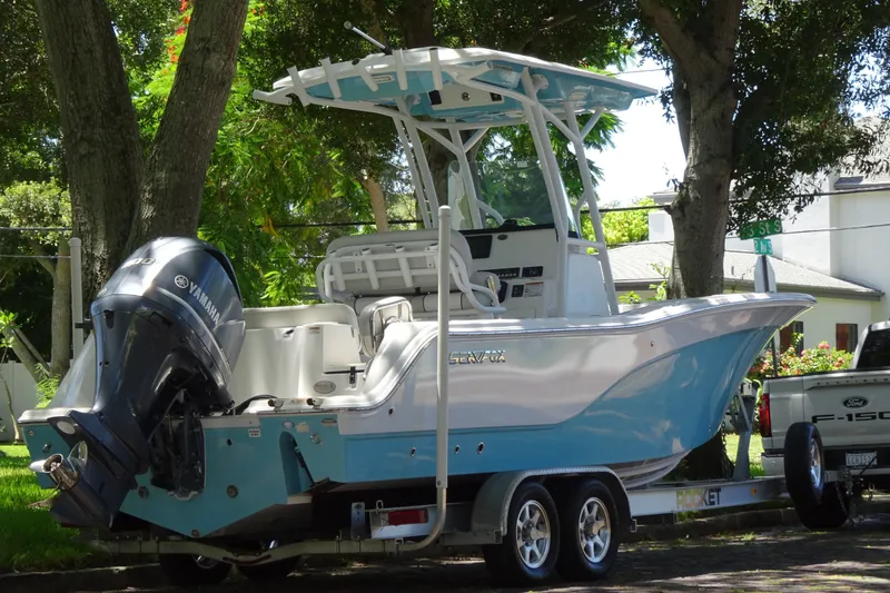 Slide: The Image of 2021 Sea Fox 248 Commander boat on trailer, featuring Yamaha outboard motor, parked outdoors. - 6