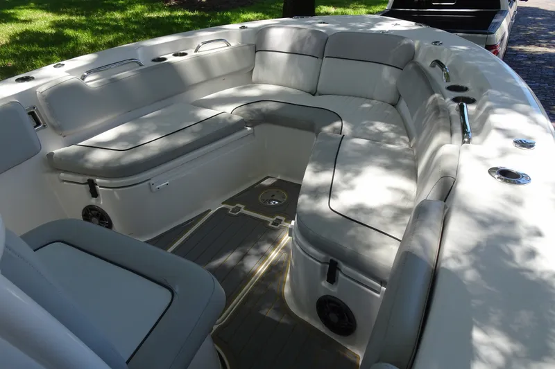 Slide: The Image of Spacious seating area on 2021 Sea Fox 248 Commander boat, featuring cushioned seats and cup holders. - 18