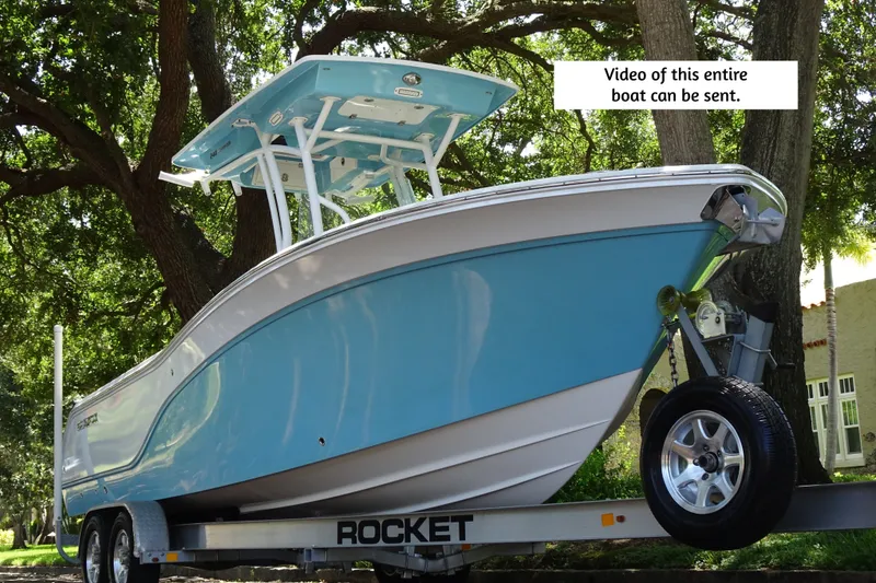 Slide: The Image of 2021 Sea Fox 248 Commander boat on trailer under trees. - 3