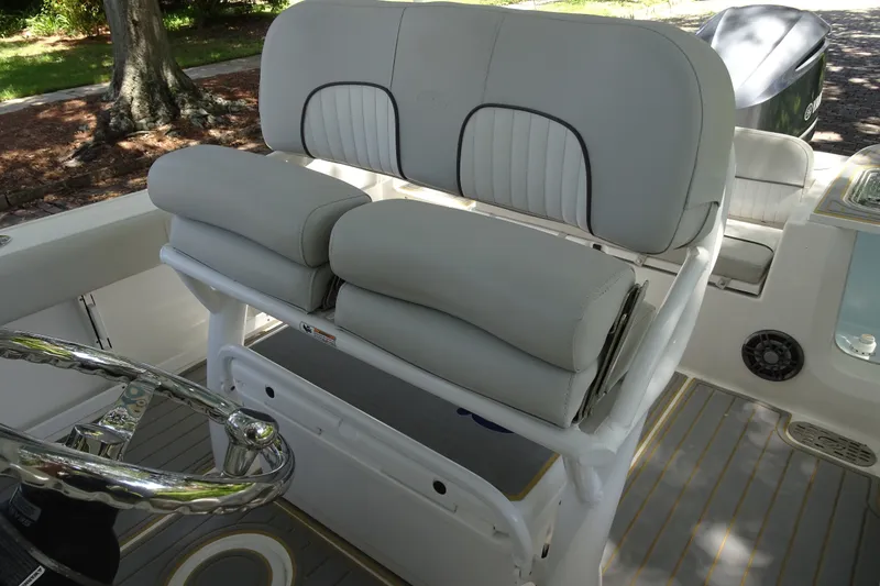 Slide: The Image of 2021 Sea Fox 248 Commander boat interior with cushioned seating and steering wheel. - 12