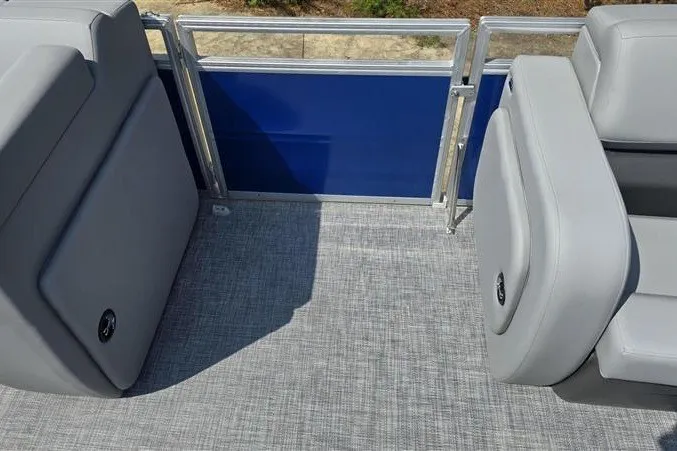 Slide: The Image of 2027 Sun Tracker SportFish 22 DLX pontoon boat interior with gray seating and blue panel. - 12