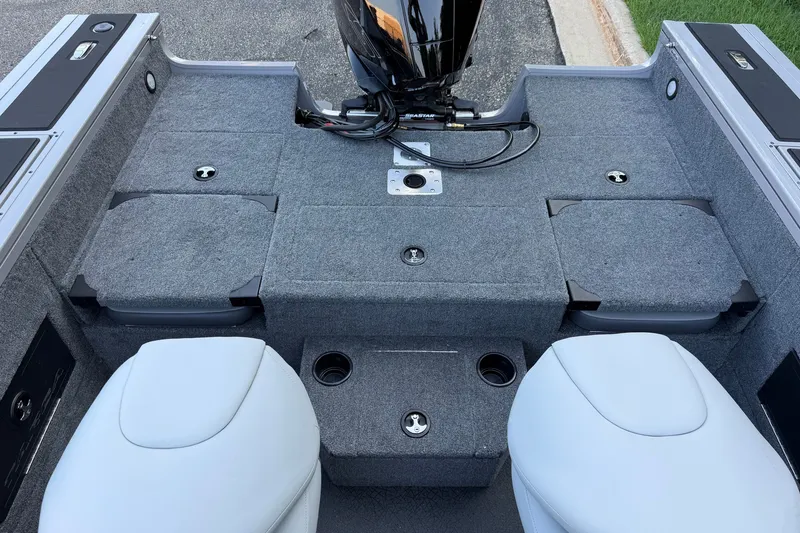 Slide: The Image of 2027 Tracker Targa V-18 Combo boat interior with gray carpet and seating. - 16