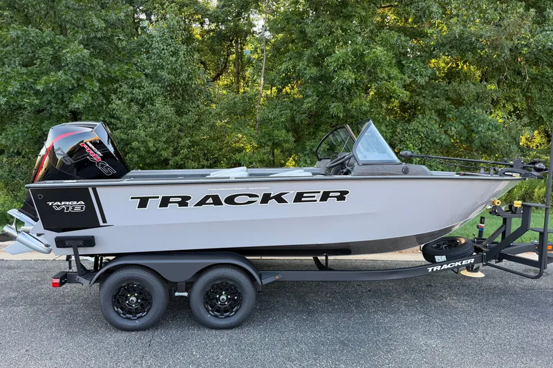 The Image of 2027 Tracker Targa V-18 Combo boat on trailer, parked outdoors. - 0