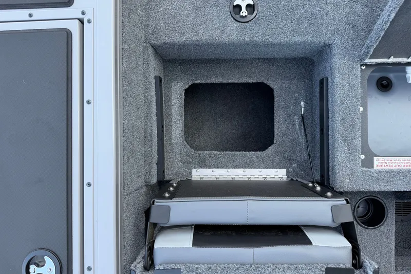 Slide: The Image of Interior view of 2027 Tracker Targa V-18 Combo boat storage compartment. - 18