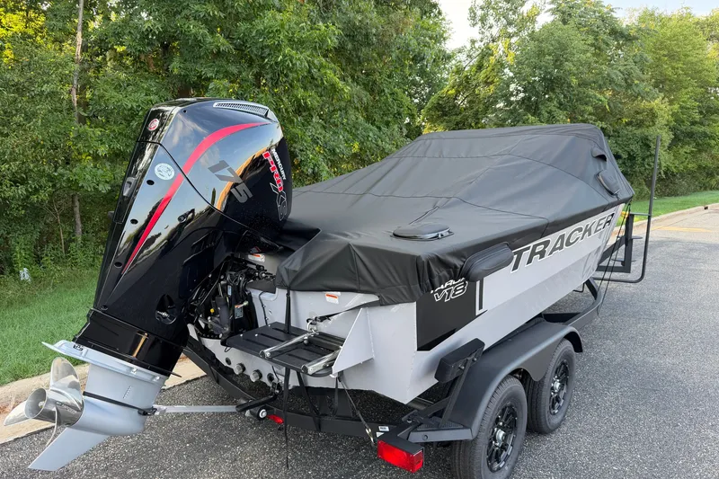 Slide: The Image of 2027 Tracker Targa V-18 Combo boat with cover and powerful outboard motor. - 21