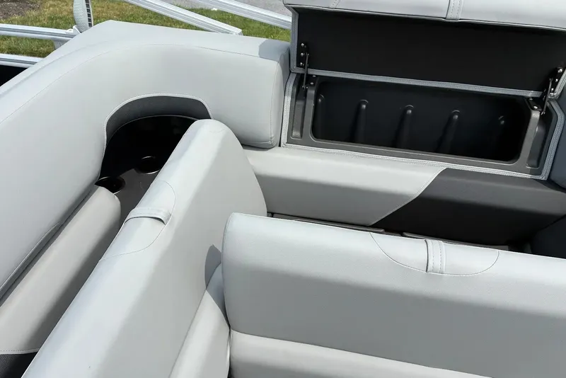 Slide: The Image of 2027 Sun Tracker SportFish 22 DLX boat interior with open storage compartment. - 14