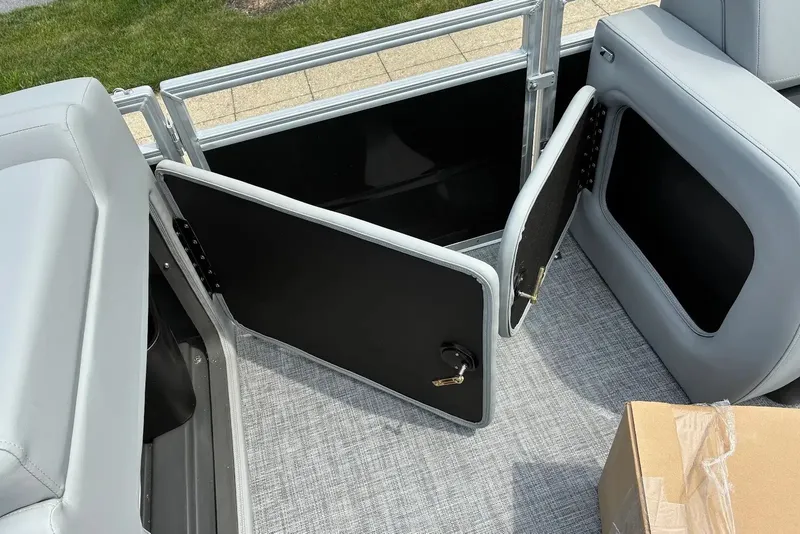Slide: The Image of 2027 Sun Tracker SportFish 22 DLX boat interior with open gate and seating. - 13