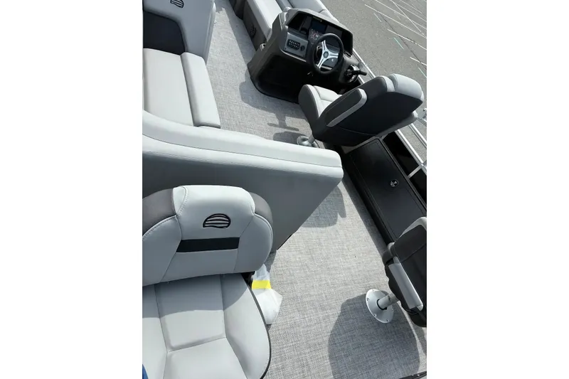 Slide: The Image of Interior view of 2027 Sun Tracker SportFish 22 DLX boat with gray seating and steering console. - 18