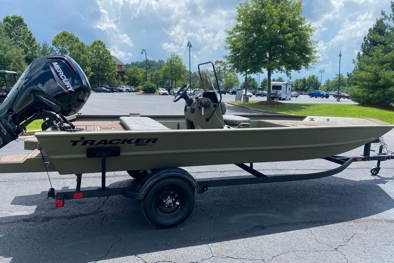 The Image of 2027 Tracker Grizzly 1860 CC boat on trailer in parking lot. - 0