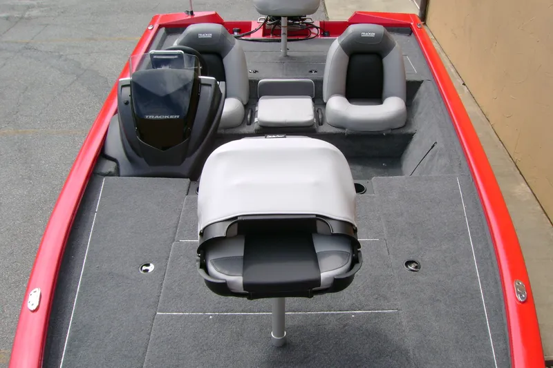 Slide: The Image of 2027 Tracker Pro Team 195 boat interior with gray seating and red trim. - 38