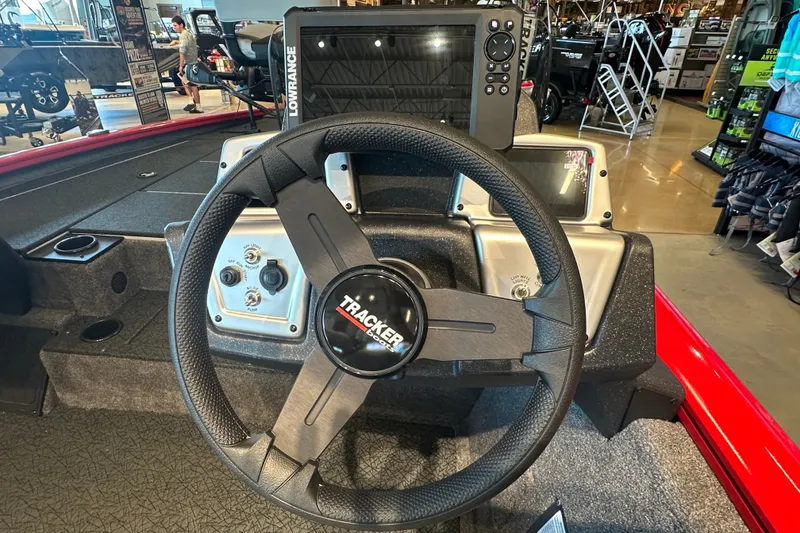 Slide: The Image of Steering wheel of a 2027 Tracker Pro Team 195 boat with Lowrance electronics. - 45