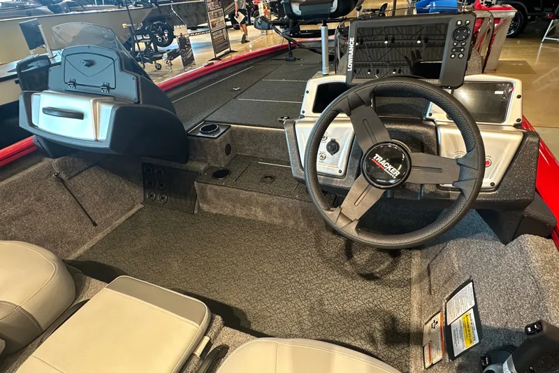 Slide: The Image of 2027 Tracker Pro Team 195 boat interior with steering wheel and control panel. - 44