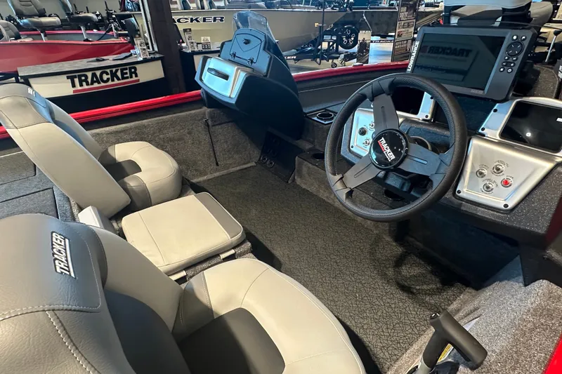 Slide: The Image of Interior of 2027 Tracker Pro Team 195 boat with steering wheel and seats. - 43